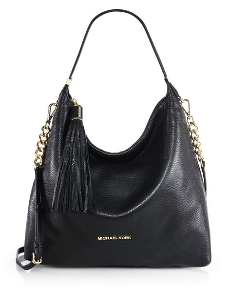 michael kors silver and black tassel|michael kors official website.